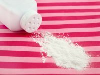 : Spilled baby scented powder on striped background